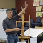 Master conductor Robert Franz demonstrates hand positions